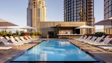 Outdoor pool, open 9:00 AM to 9:00 PM, pool umbrellas, pool loungers