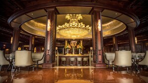A luxurious lobby with a grand chandelier, marble flooring, and elegant seating arrangements. - Fairmont El San Juan Villa Experience (Carolina)