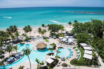 4 outdoor pools, open 7:00 AM to 9:00 PM, sun loungers at Fairmont El San Juan Villa Experience