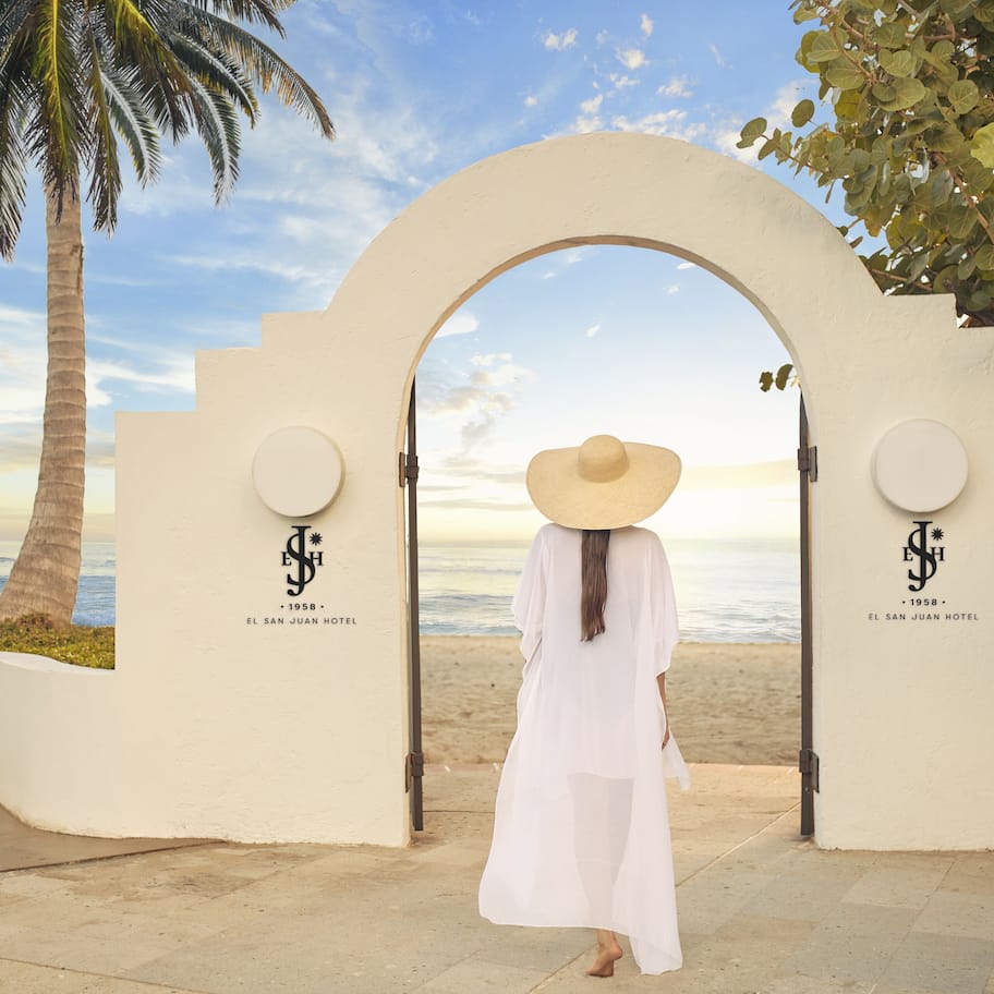 On the beach, white sand, beach cabanas, beach towels