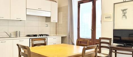 Fridge, oven, dining tables