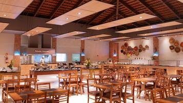 A spacious restaurant with high ceilings, wooden tables and chairs, and a central bar area.