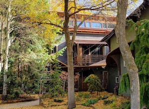 A two-story building with a balcony and a covered walkway. - Monthly Rental- The Architect's Annex in the Bozeman's Downtown Brewery District (Bozeman)