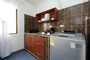 Fridge, microwave, stovetop, coffee/tea maker