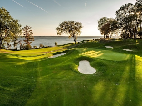 Golf. Luxury Riverfront Condo w/ sunrise & sunset views