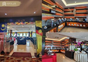 A hotel lobby with a reception desk, seating area, and a buffet setup. - Hock Lee Hotel And Residences (Kuching)
