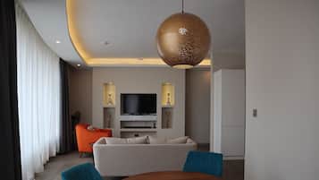 Luxury Apartment | Living area | Flat-screen TV
