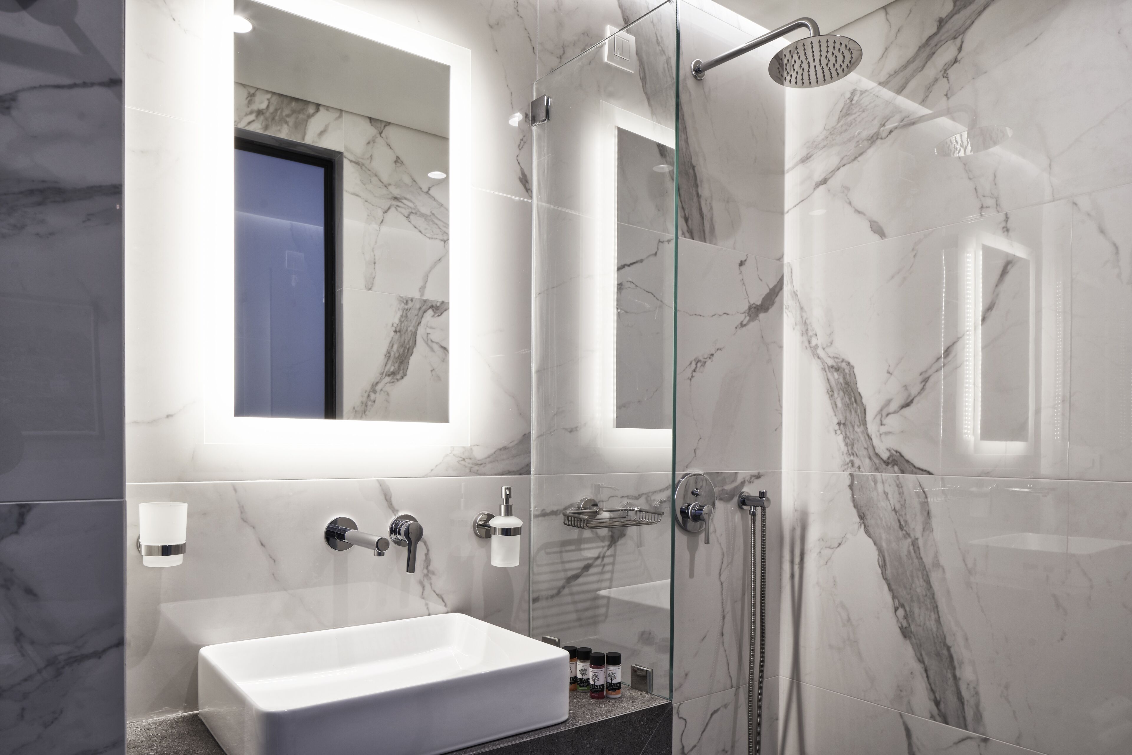 family loft (suite) | bathroom | shower, rainfall showerhead, eco-friendly toiletries, hair dryer