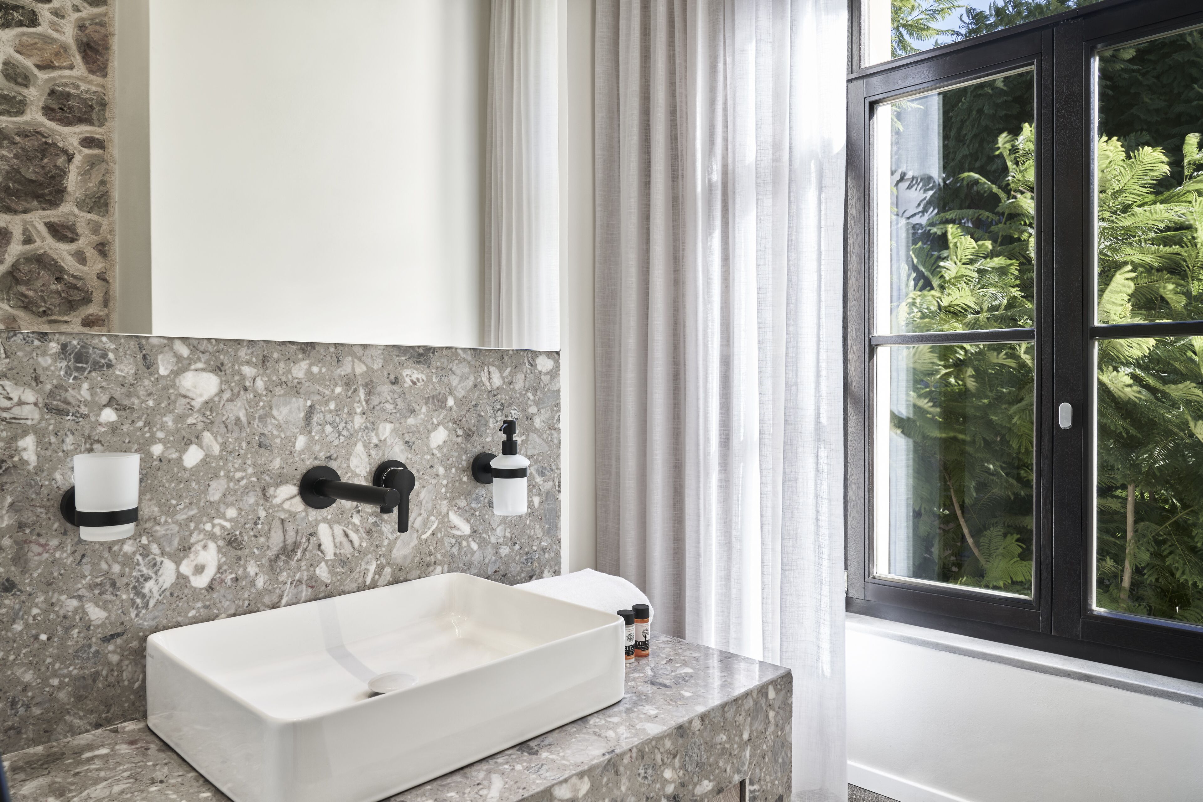 superior loft suite balcony | bathroom | shower, rainfall showerhead, eco-friendly toiletries, hair dryer