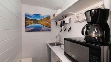 Fridge, microwave, stovetop, coffee/tea maker