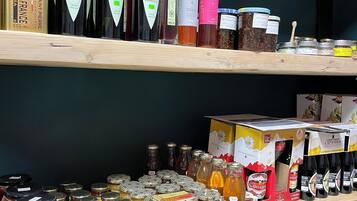 Shelves stocked with various bottles and jars, likely containing food products or condiments.