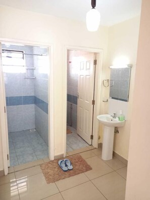 Deluxe Apartment, 2 Bedrooms | Bathroom | Shower, soap, shampoo, toilet paper - Lilly's Furnished Apartments (Nakuru)