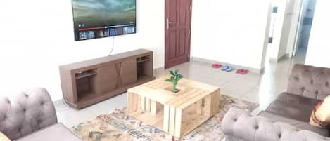 Deluxe Apartment, 2 Bedrooms | Living area | Flat-screen TV