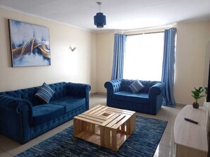 Appartement Standard, 2 chambres | Aire de séjour | Téléviseur à écran plat