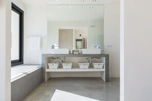 Bathtub, hair dryer, towels