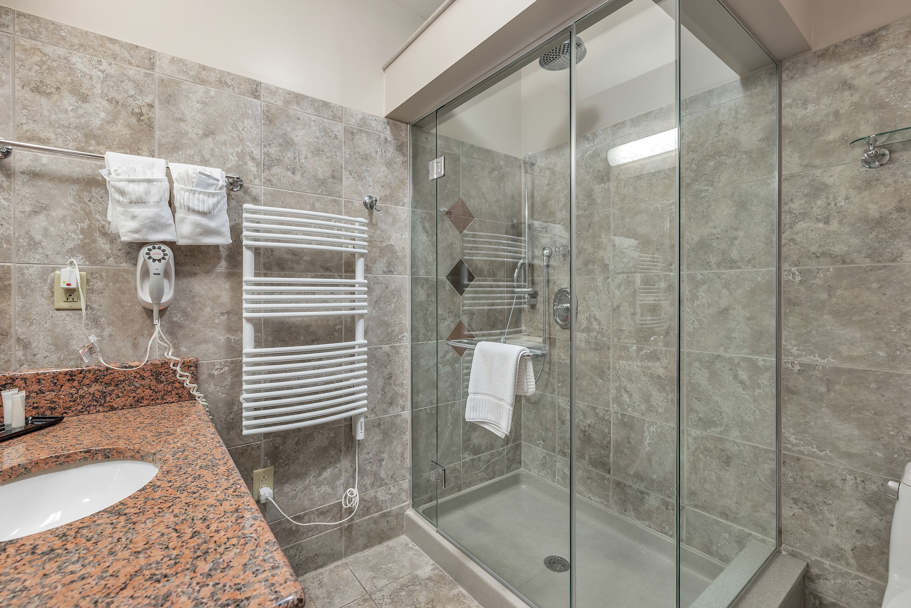 deluxe room | bathroom | rainfall showerhead, hair dryer