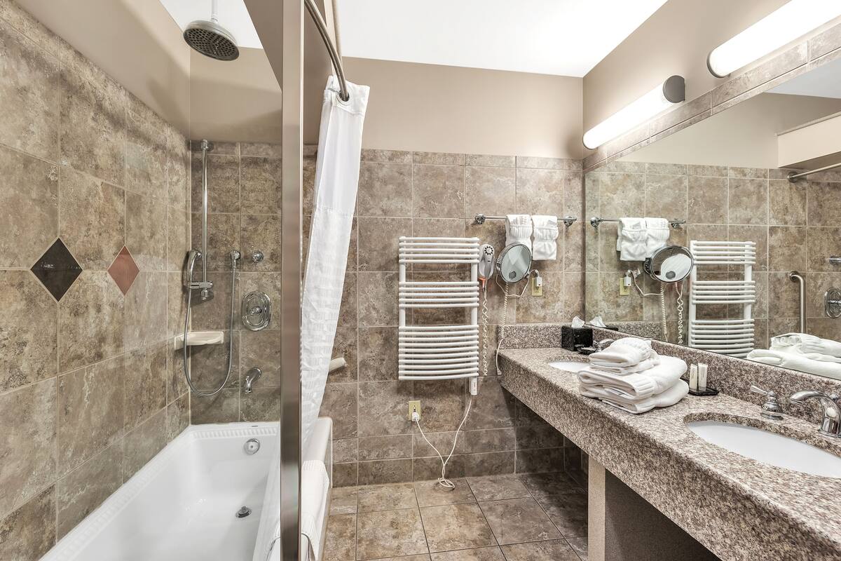 deluxe room | bathroom | rainfall showerhead, hair dryer