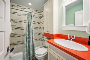 Combined shower/bathtub, hair dryer, towels, soap