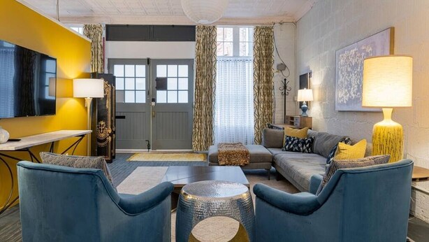 A modern living room with a sofa set, a coffee table, and a TV. - 35 Carolina Lane  Loft Downtown on Historic Alley + One Free Off Street Parking (Asheville)