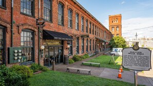 A historic brick building with a sign for Marathon Motor Works. - SKYLINE ROOFTOP DECK 4 BEDROOMS KING BED LARGE KITCHEN L2 EV CHARGER PETS GARAGE (Nashville)