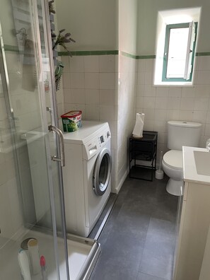 Shower, hair dryer, towels, soap