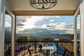 A balcony with a view of mountains and a sign that reads "BLESSED". - Fall in Pigeon Forge | Views, Pools & Free Tickets (Pigeon Forge)