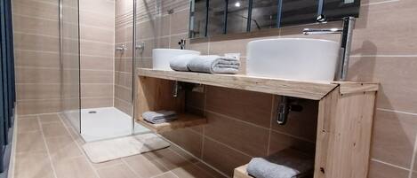Shower, hair dryer, towels, soap