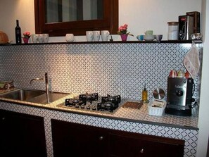 Fridge, microwave, stovetop, coffee/tea maker