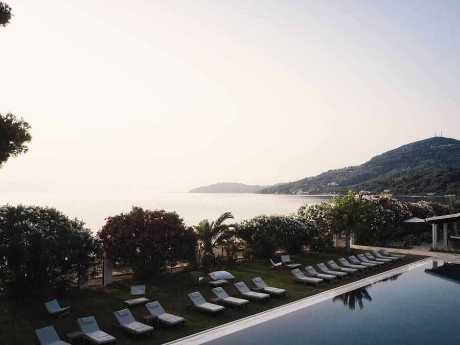 Seasonal outdoor pool, open 10:00 AM to 6:00 PM, pool umbrellas