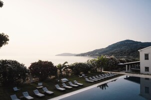 Seasonal outdoor pool, open 10:00 AM to 6:00 PM, pool umbrellas