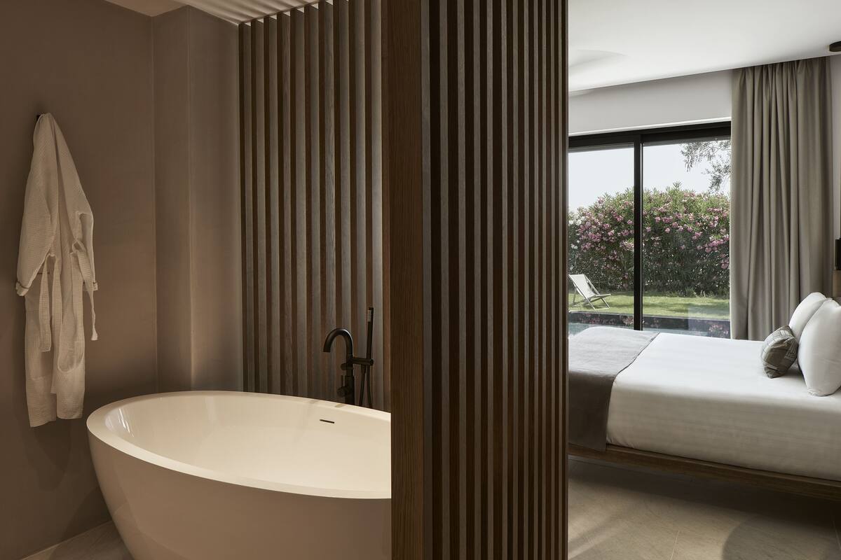 ionian beachfront suite, private pool | bathroom | hair dryer, bathrobes, slippers, towels