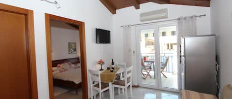 Apartment, 1 Bedroom, Smoking, Balcony | Living area | 40-inch flat-screen TV with satellite channels, TV