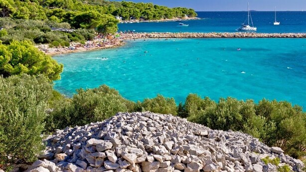 A coastal area with clear turquoise waters, rocky terrain, and lush greenery. - Villa Pina TOP****Apartment Nicos at the see 2-4 persons (Tisno)