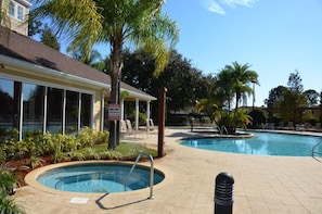 A pool area with lounge chairs and a spa sign. - December Special Lucaya 4 Bed 3 Bath Id:236904 (Kissimmee)