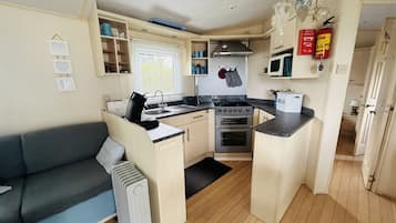 Fridge, microwave, stovetop, coffee/tea maker