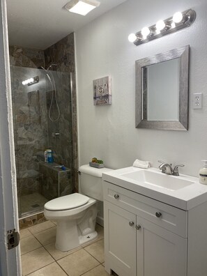 Shower, towels, soap, toilet paper