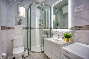 Shower, hair dryer, towels, soap