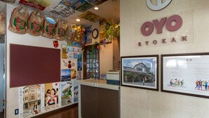 A reception area with a large sign reading "OYO RYOKAN". - Tabist Business Ryokan Duck Ishinomaki Hebita (Isinomaki)