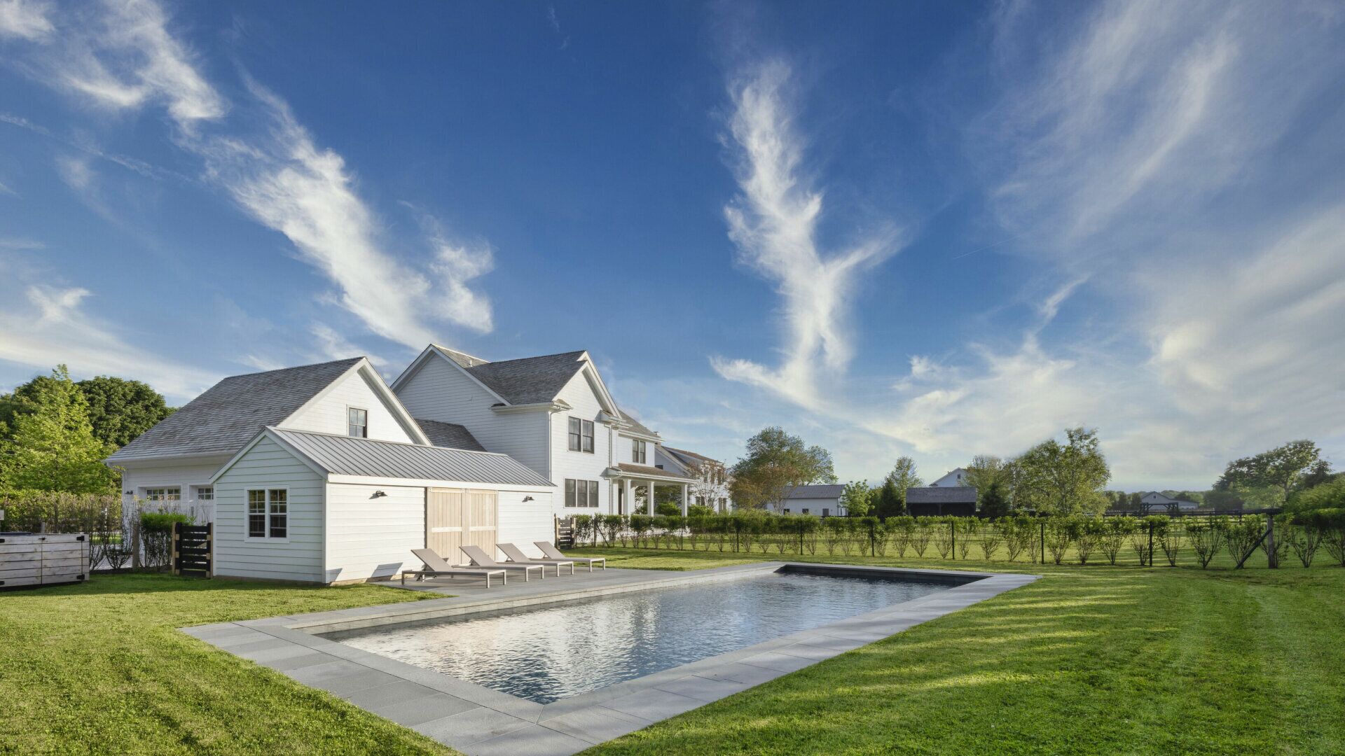 Retreat to this farmhouse compound nestled in the heart of Sagaponack Village!