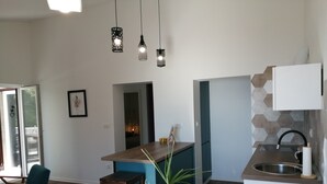 A modern kitchen with a central island, pendant lighting, and a view into the dining area. - Apartments Tamara (ST)- Two Bedroom Apartment with Balcony (Lokva Rogoznica)