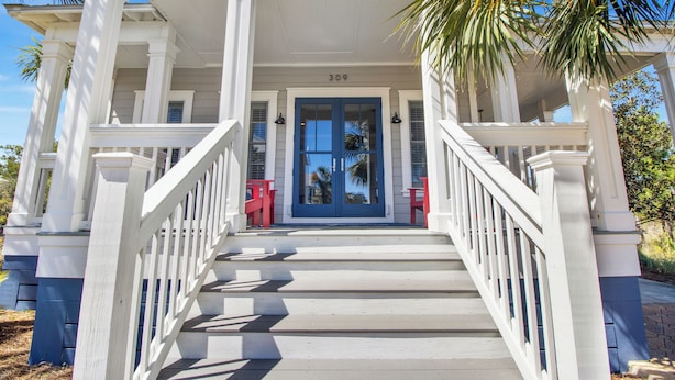 A white house with a blue door and the number 309. - THE GOOD STUFF IS A LUXUROUS 3BD HOME W/COMMUNITY POOL, GATED COMMUNITY! (Port Saint Joe)