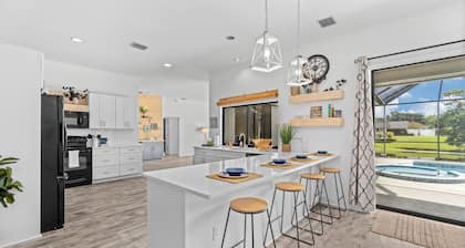 Large pool/spa home minutes from beach with arcade games and canal for fishing.