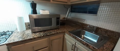 Fridge, oven, coffee/tea maker, toaster