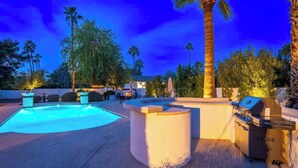 A pool area with a hot tub, grill, and lounge chairs. - Luxury Desert Oasis+Sport Court+Theater+Golf+ Spa (Scottsdale)