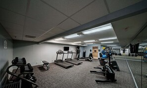 A gym with treadmills, weight machines, and exercise balls. - Stunning Beach Retreat! Beachfront Condo/Spectacular Balcony-Beach Service! Pool (panama city beach)