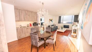 Family Apartment, Multiple Beds, Kitchen, Sea View | Living area | 45-inch Smart TV with satellite channels, TV