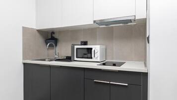 Fridge, microwave, stovetop, coffee/tea maker