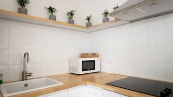 Comfort Apartment, 2 Bedrooms | Private kitchen | Full-size fridge, microwave, stovetop, coffee/tea maker