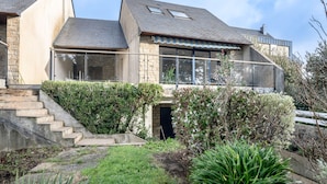 A modern two-story house with a stone facade, large windows, and a visible staircase leading to the entrance. - Arzon- house for 2 with great seaview (Arzon)