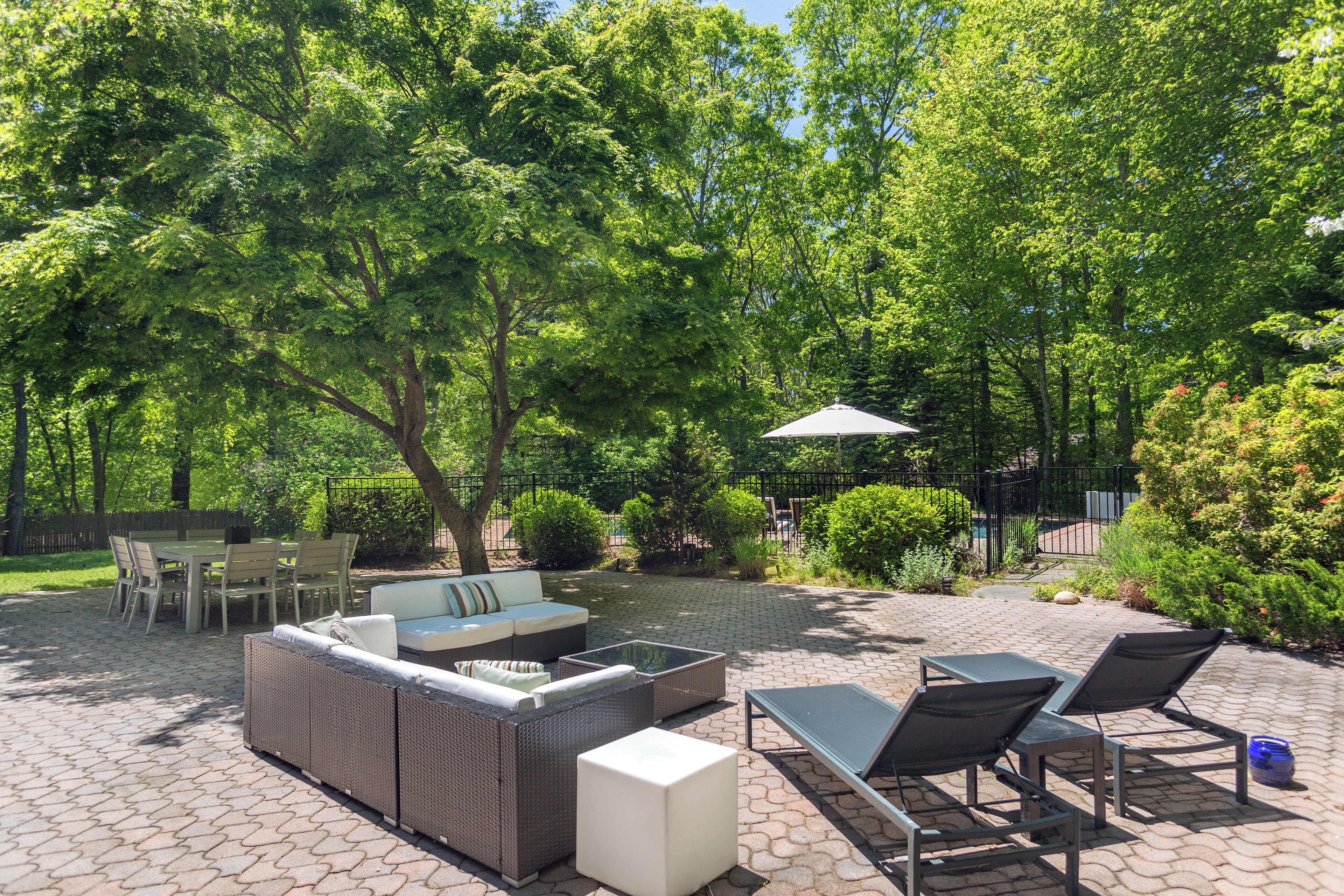 Very private outdoor couch/lounge area & dining separately fenced from pool area